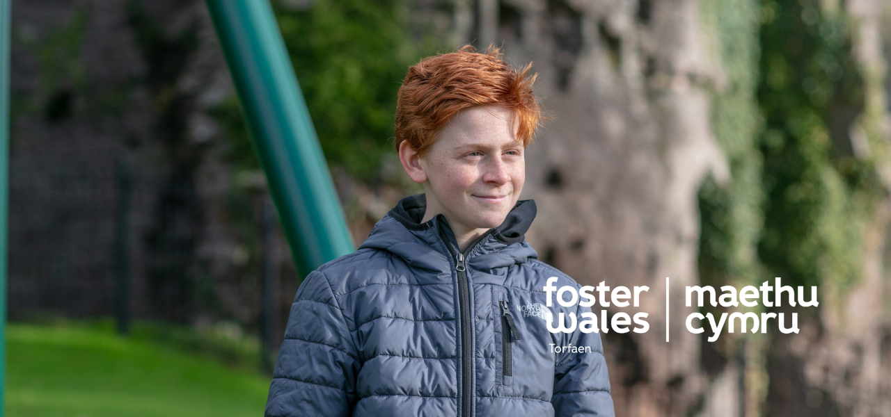 foster wales hero image of young boy with red hair smiling