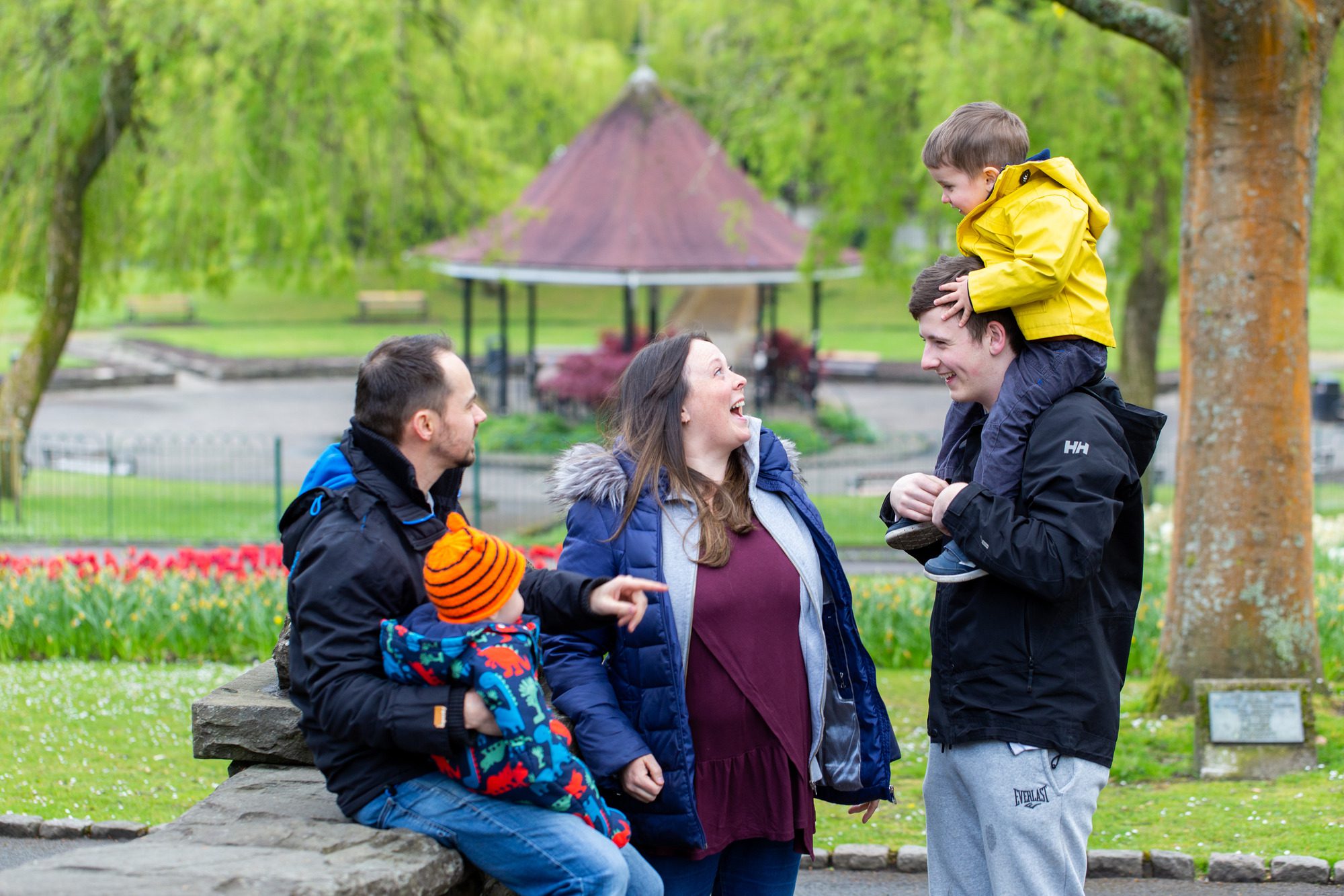 A smiling family with two small kids